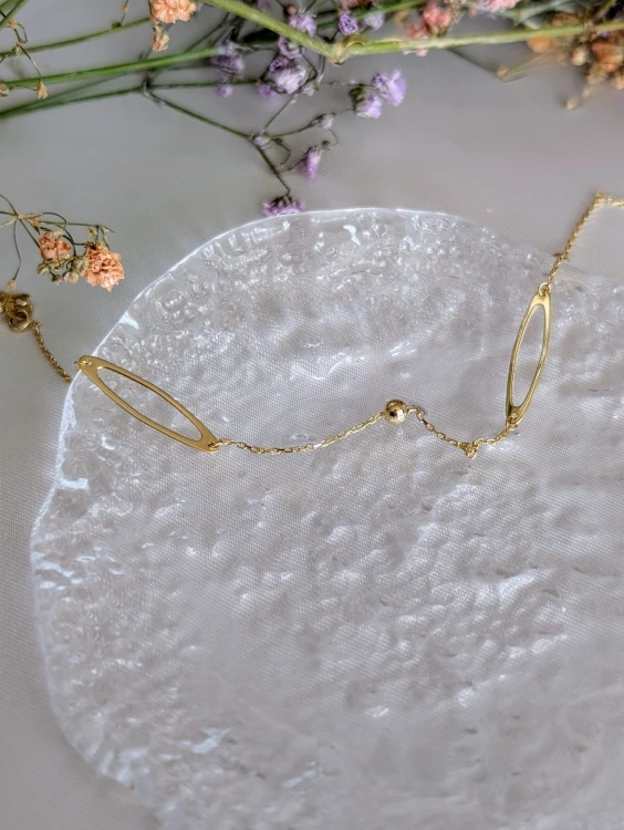 Złota błyszcząca bransoletka z kuleczkami i elipsami. Splot ankier, długość 17-19 cm, średnica 4,8 mm. Zapięcie sprężynowe Federing. Elegancka złota biżuteria.